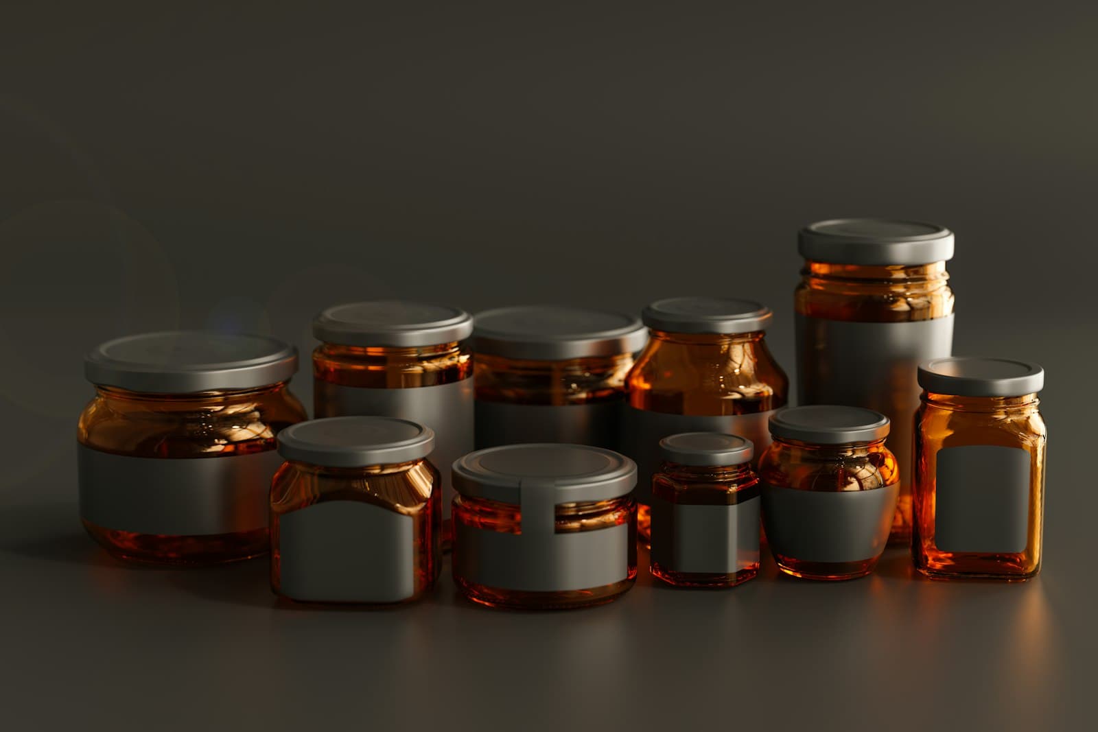 A filling head dosing white bottles on a conveyor, unlabelled bottles under a rotary filler, amber jars with blank labels, an open amber bottle with capsules beside it, rows of plain ceramic cups, and a container terminal from the air